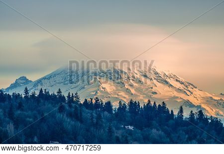 Clouds Cover Mount Rainier Across The Puget Soud In Washington State.
