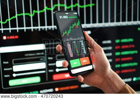 Crypto Trader Broker Using A Cell Phone Financial App To Buy Or Sell Shares Of Stock Market. Investm