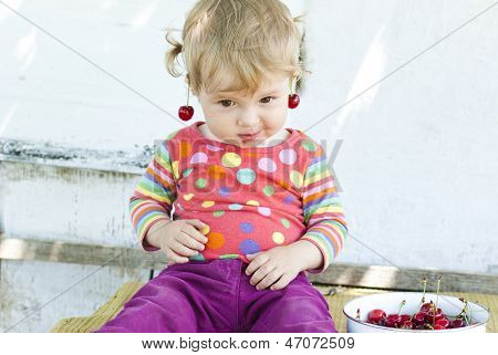 Little Girl With A Cherry