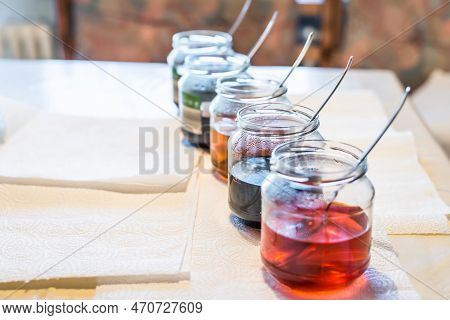 Easter Eggs Color At Home In The Kitchen With Cucumber Glasses And Various Colors, Germany