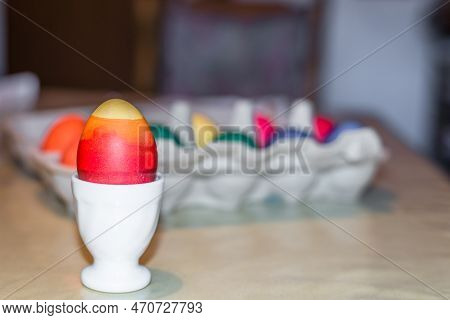Colourful Self-dyed Easter Eggs In An Egg Cup And An Egg Carton, Germany