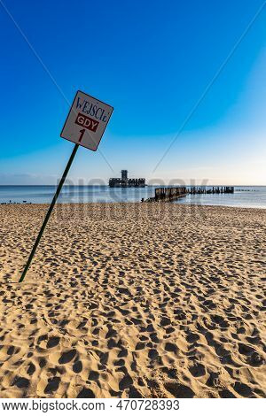 Gdynia, Poland - April 2022: First Entrance To Babie Doly Beach With Old Ruins Of Pier And Ruins Of 