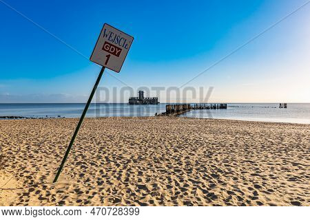Gdynia, Poland - April 2022: First Entrance To Babie Doly Beach With Old Ruins Of Pier And Ruins Of 