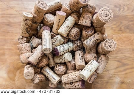 Regensburg, Bavaria, Germany, April 27, 2019,  Many Wine Corks Of Different Wines In A Large Glass C