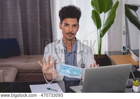 Brazilian Black Doctor Or Veterinarian Working At Home. Young Man Doing Home Office During The Day A