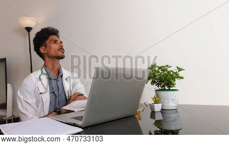 Brazilian Black Doctor Or Veterinarian Working At Home. Young Man Doing Home Office During The Day A
