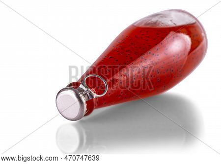 Red Drinks With Basil Seeds Or Falooda Seeds Or Tukmaria In Bottles On White Background