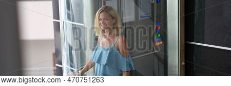 Beautiful Smiling Woman In Transparent Glass Elevator. Stylish Modern Elevators In Hotels And Busine