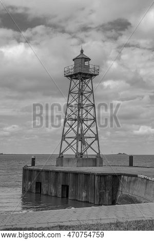 Small Green Lighthouse At The Mouth Of The Geeste River In The North Sea, Bremerhaven