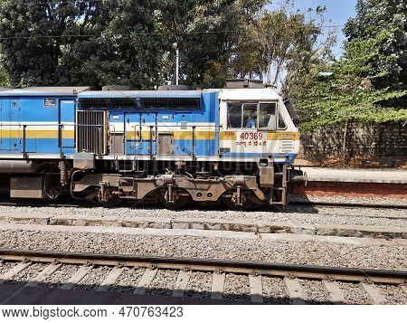 Closeup Of Beautiful Mandya Railway Station And Electric Train Moving On A Track.