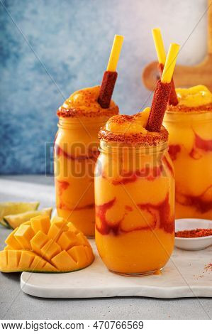 Mangonada Mexican Mango Smoothie With Chamoy Sauce And Chili Lime Seasoning And Tamarind Candy Straw