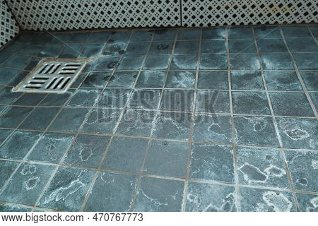 Extremely Dirty Bath Drain Mesh, Hole And Tiles Surface Covered With Limescale. Marks On Tiles In A 