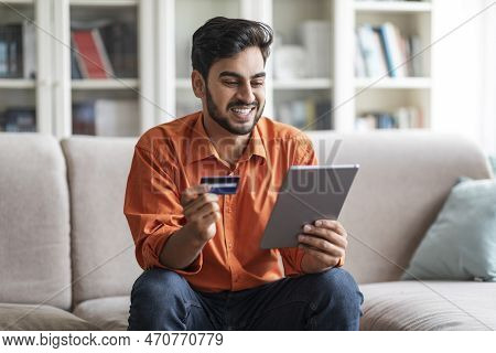 Cheerful Middle Eastern Man Order Food Online, Using Digital Pad