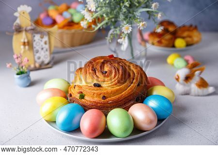 Craffin (cruffin) With Raisins And Candied Fruits. Traditional Easter Bread Kulich And Painted Eggs 
