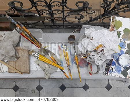 Painter Brushes Over Table