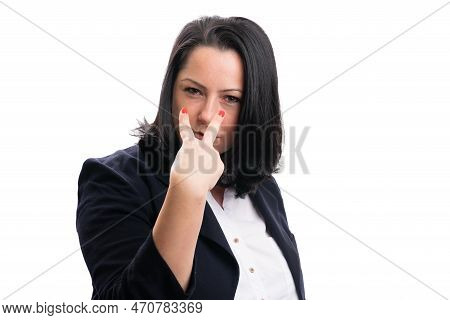 Adult Businesswoman Wearing Formal Suit With Serious Expression Making Eyes On You Gesture Using Fin