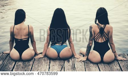 Young Sexy Slim Women In Swimsuit Posing. Beautiful Young Women Opened The Beach Season. Hen-party C