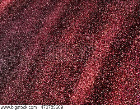 Bokeh Light Of Pink Glitters On Black Background. Magenta Glitter Texture. Sparkling Glitter Wrappin