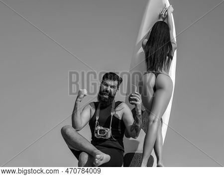 Summer Couple Vacation. Sexy Woman In Bikini. Summertime Concept. Sexy Man In Swimsuit. Surfboard. L