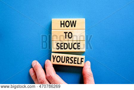 How To Seduce Yourself Symbol. Concept Word How To Seduce Yourself On Wooden Blocks. Businessman Han