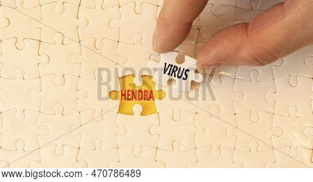 Hendra Virus Symbol. Concept Words Hendra Virus On White Paper Puzzles. Beautiful Yellow Table Yello