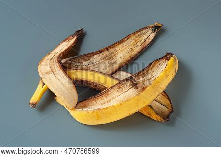 Peel Of An Overripe Banana On A Gray Background. Overripe Banana Macro. Food Waste