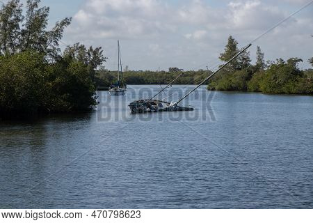 Vero Beach, Florida, United States - January 1, 2023: Sailboat Sunk In An Anchorage At Vero Beach In