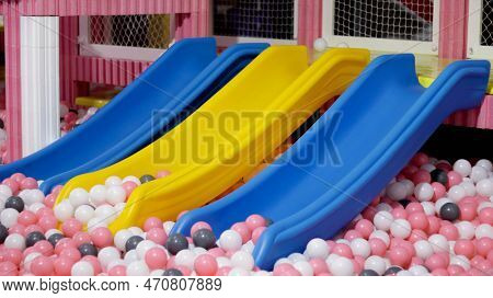 Children Slider And A Ball Pool At Indoor Playground Allow Kids Doing Sports Exercises Or Physical E