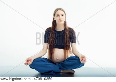 Pleasant Pregnant Woman Posing In Profile And Trying Yoga Young Happy Expectant Relaxing, Thinking A