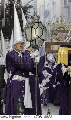 Zaragoza - Spain - April 15th 2023 - Nazarene Taking A Break During A Holy Week (semana Santa) Proce