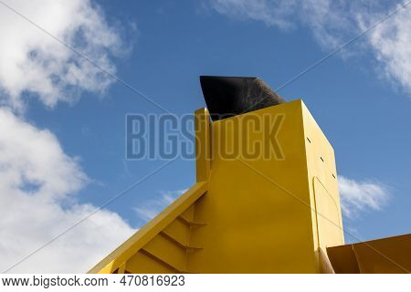 Bright Yellow Chimney Of A Shuttle Boat, Trasnport From Lanzarote To Fuerteventura. Blue Sky With Wh