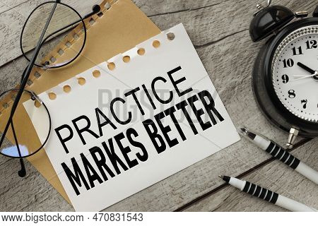 Practice Makes Perfect. Stationery On A White Office Table.