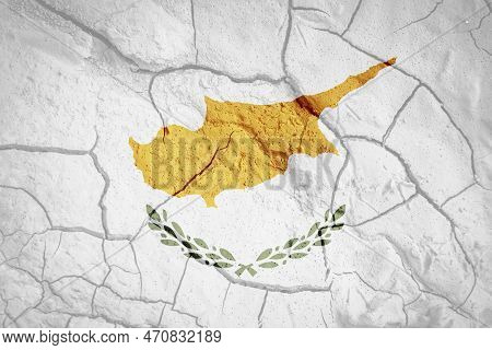 Flag Of Cyprus. Cyprus Symbol. Flag On The Background Of Dry Cracked Earth. Cypriot Flag With Drough