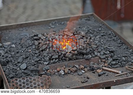 Coal Fire In The Forge Of A Blacksmith's Workshop In Prague.