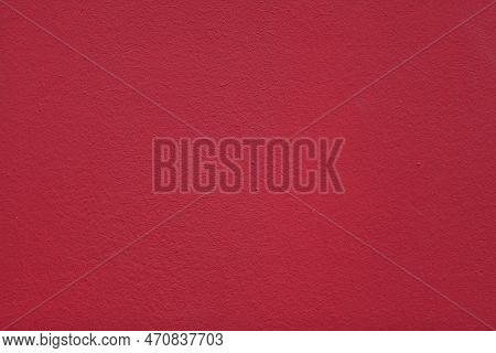 Full Frame Close-up On A Concrete Wall Painted In Red