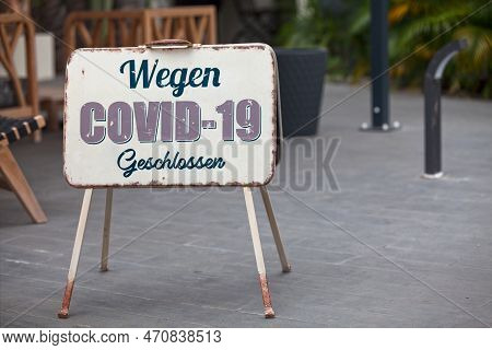 Outdoor Open Sign With Written In It In German 