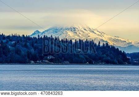 Clouds Cover Mount Rainier Across The Puget Soud In Washington State.