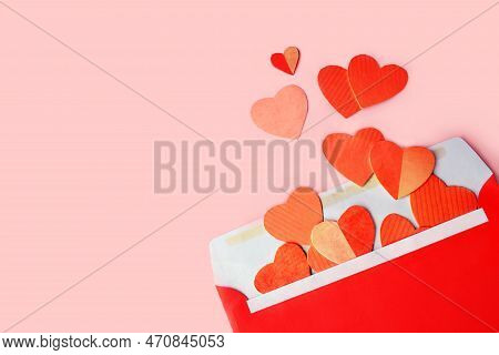 Envelope With Red Hearts On Pink Background