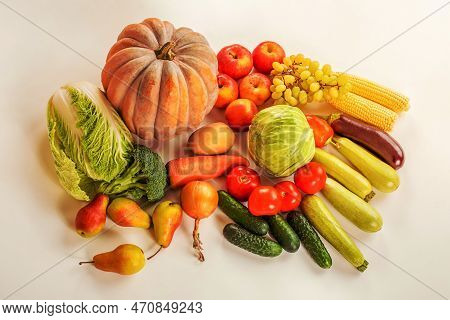 A Variety Of Vegetables And Fruits On A White Background. Harvesting.