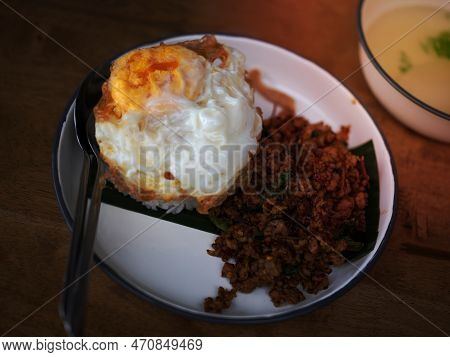 Pad Krapow Moo - Thai Basil Pork With Rice And Fried Egg  Background. Thai Cuisine Dish With Minced 