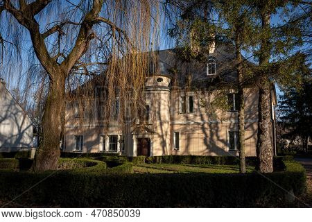 Krzyzowice, Poland - February 9, 2023: Xvii Century House, A Part Of Krzyzowice Palace Complex, Surr