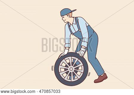 Man Automobile Repairman Changes Car Wheel To New One To Avoid Accident Or Perform Scheduled Inspect