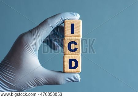 Icd ( Implantable Cardioverter-defibrillator) S An Acronym On Cubes Held By A Hand In A Blue Glove. 
