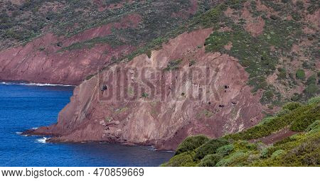 Rocky Cliffs On The Sea Coast. Sardinia, Italy. Nature Background