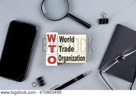Wooden Cubes Wto - World Trade Organization Wtih Notebook , Magnifier And Smartphone, Business