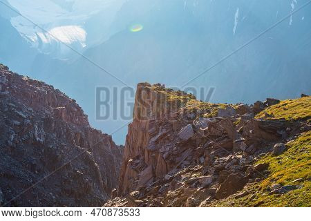 Sunny Mountain View From Cliff At Very High Altitude. Scenic Alpine Landscape With Beautiful Sharp R