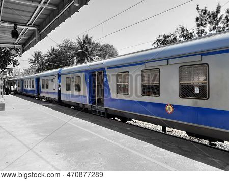 Closeup Of Beautiful Mandya Railway Station And Electric Train Moving On A Track.