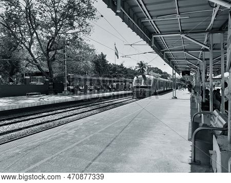Closeup Of Beautiful Mandya Railway Station And Electric Train Moving On A Track.
