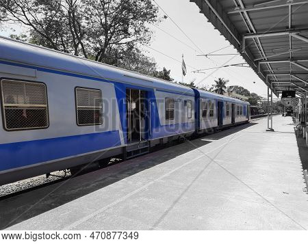 Closeup Of Beautiful Mandya Railway Station And Electric Train Moving On A Track.