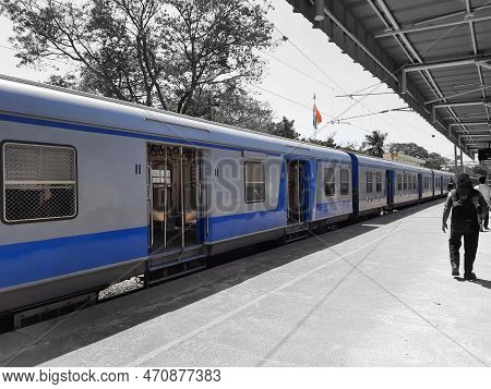 Closeup Of Beautiful Mandya Railway Station And Electric Train Moving On A Track.
